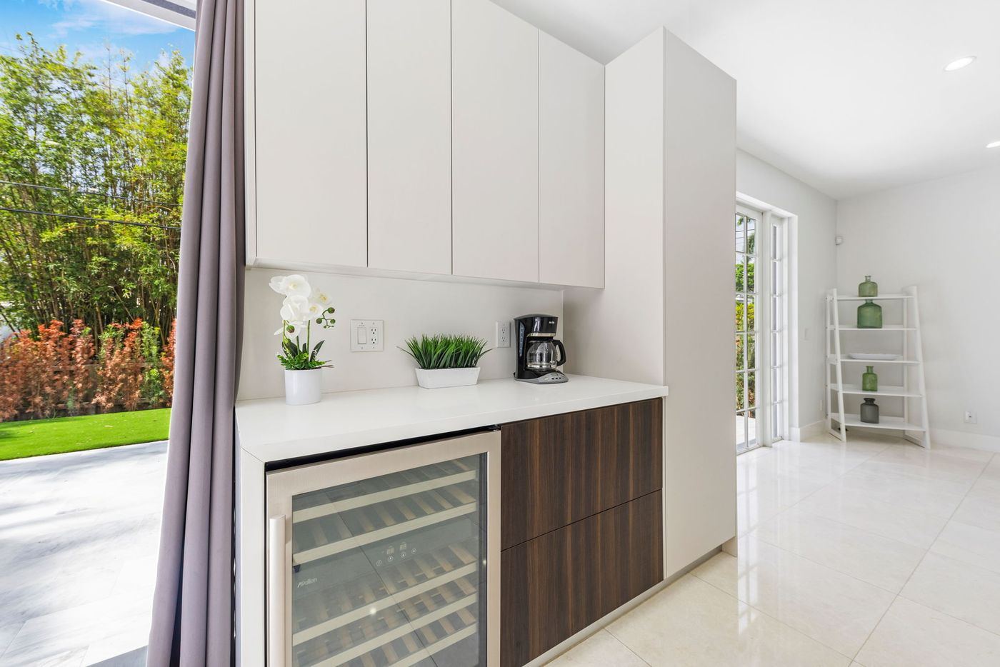 Built-in wine fridge and dark wood cabinetry, kitchen remodel by MySFContractor