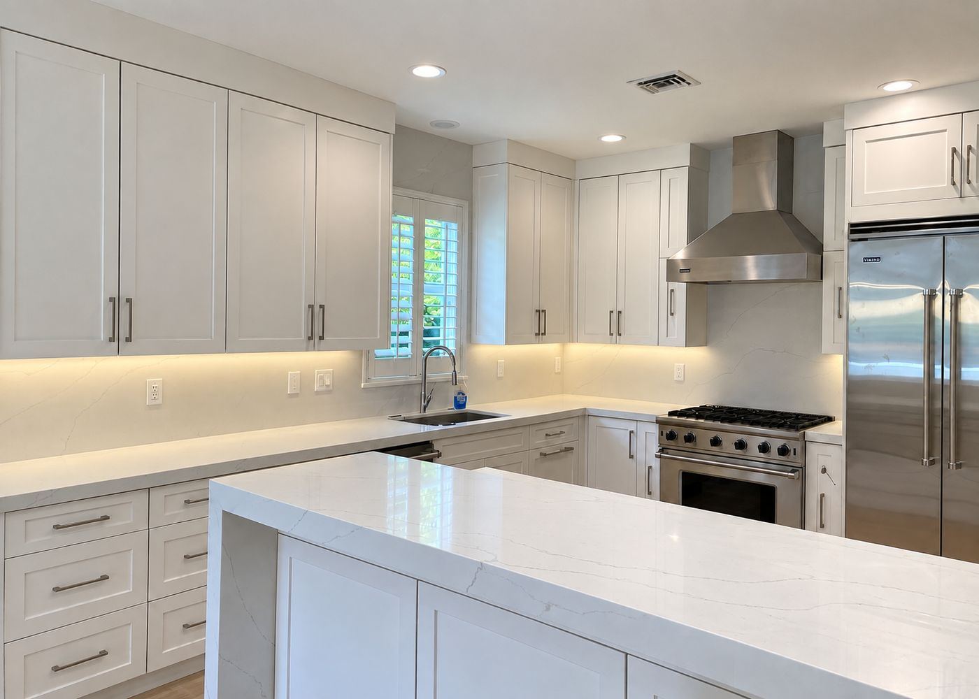 White kitchen with waterfall island, kitchen remodel by MySFContractor
